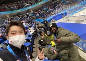 Sidney Chu with the Jamaican Delegation at the opening ceremony of the Beijing 2022 Winter Olympic Games